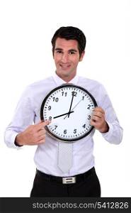 happy businessman pointing at clock