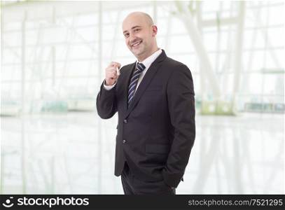 happy businessman smoking at the office