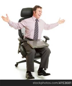 Happy businessman spinning around in his comfortable new ergonomic chair.