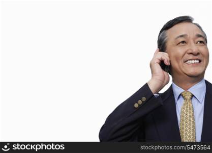 Happy businessman using cell phone over white background