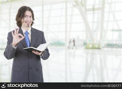 happy businessman with a book at the office