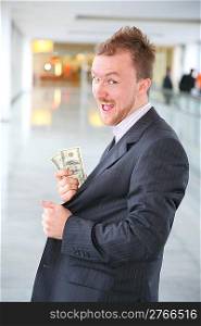 happy businessman with dollars