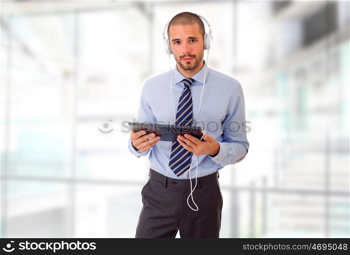 happy businessman working with a tablet pc, at the office