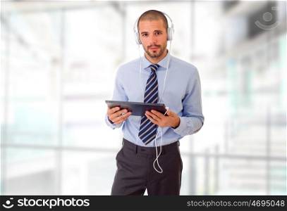 happy businessman working with a tablet pc, at the office