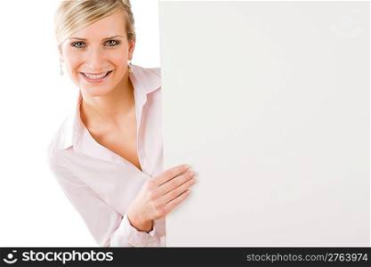 Happy businesswoman behind blank advertising banner landscape