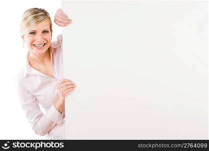 Happy businesswoman behind blank advertising banner landscape
