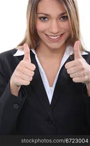 Happy businesswoman giving thumbs up gesture