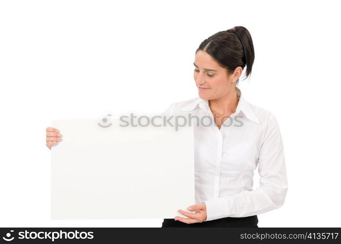 Happy businesswoman looking aside blank advertising banner on white