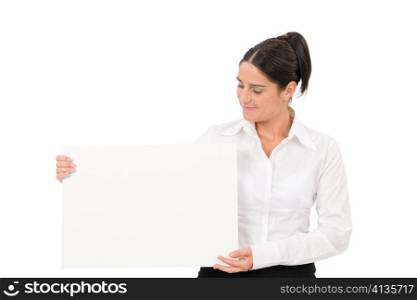 Happy businesswoman looking aside blank advertising banner on white