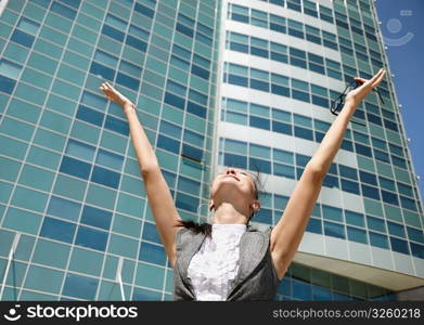 Happy businesswoman on modern business center background, selective focus