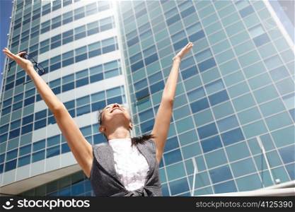 Happy businesswoman on modern business center background, special light f/x