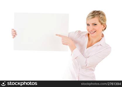 Happy businesswoman pointing aside at blank advertising banner on white
