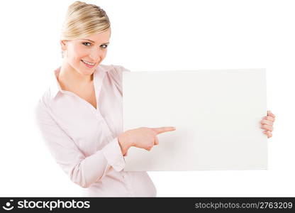 Happy businesswoman pointing aside at blank advertising banner on white