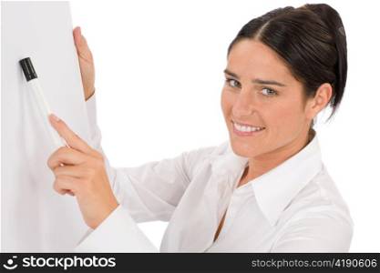 Happy businesswoman pointing at empty flip chart on white