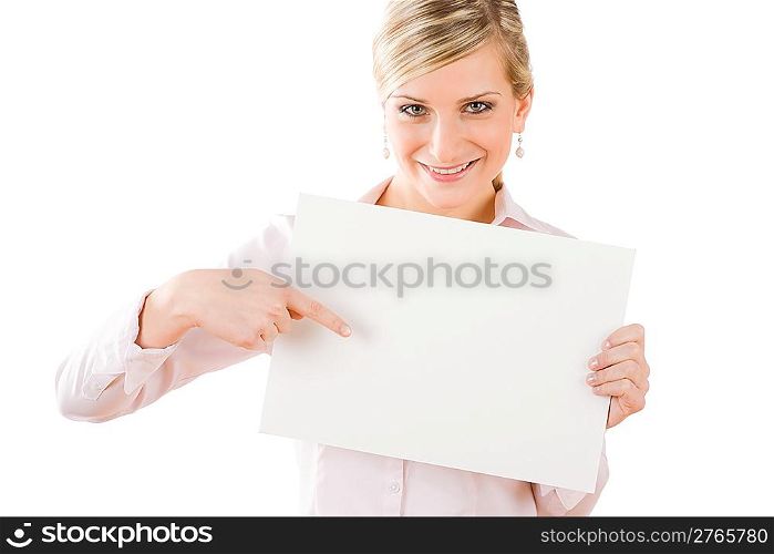 Happy businesswoman pointing front at blank advertising banner on white