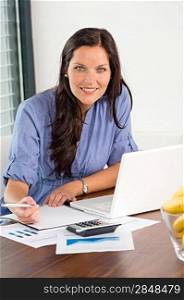 Happy businesswoman working office writing calculating finance analyzing