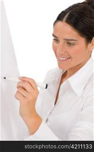 Happy businesswoman writing at empty flip chart on white