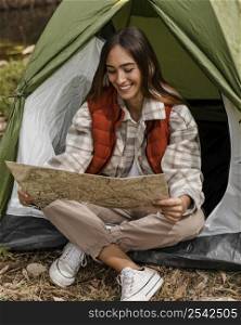 happy camping girl forest checking map smiles