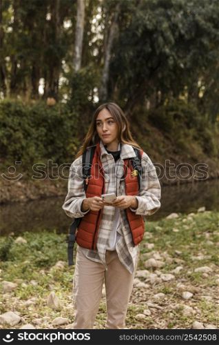 happy camping girl forest holding mobile phone