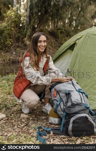happy camping girl forest searching backpack
