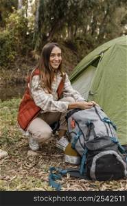 happy camping girl forest searching backpack