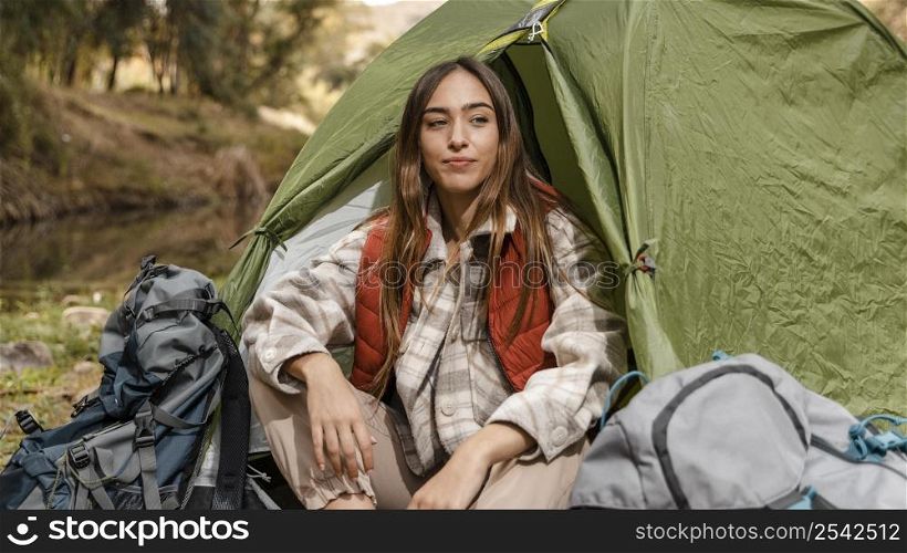happy camping girl forest sitting tent front view