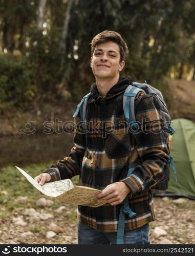 happy camping man forest holding map