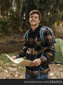 happy camping man forest holding map