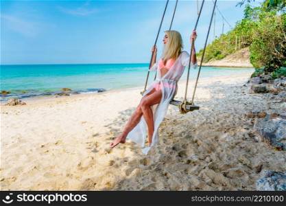 Happy Carefree Woman Enjoying Beautiful Sunset on the Beach. Happy Carefree Woman on the Beach
