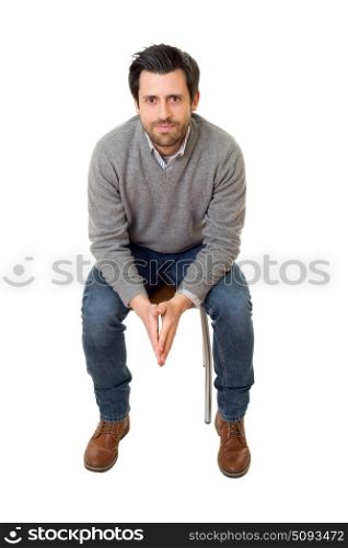 happy casual man on a chair, isolated on white background