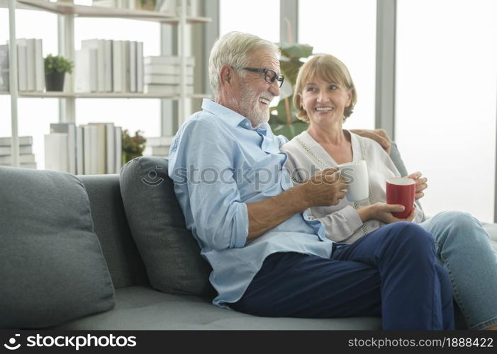 Happy Caucasian seniors couple are drinking coffee in home , relaxing and health care concept .