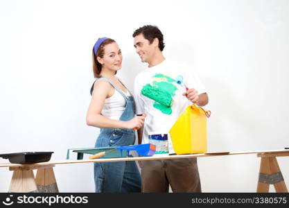 Happy Caucasian woman playing around with color on her boyfriend&rsquo;s shirt