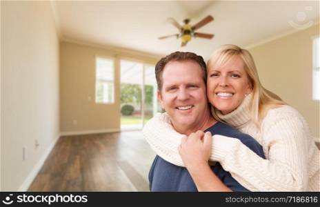 Happy Caucasian Young Adult Couple In Empty Room of House.
