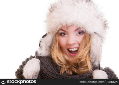 Happy cheerful blond girl young woman in warm fur hat. Winter clothes. Fashion and beauty. Studio shot. Isolated on white.