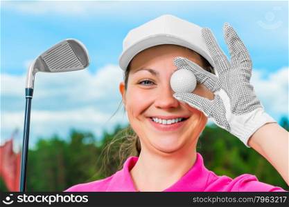 happy cheerful girl on the golf course with equipment