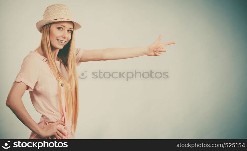 Happy cheerful teenage young woman ready for summer wearing pink outfit and sun hat.. Happy woman wearing summer outfit