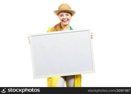 Happy cheerful woman wearing sun hat and raincoat holding blank white board. Happy cheerful woman holding blank white board