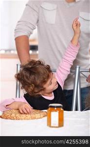 Happy child eating pancakes