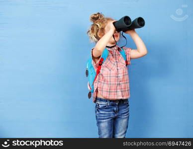 Happy child girl playing with binoculars. explore and adventure concept. Happy child girl playing with binoculars. explore and adventure concept.