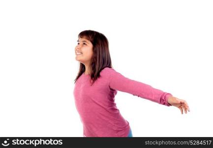 Happy child girl with pink t-shirt stretching her arms isolated on a white background