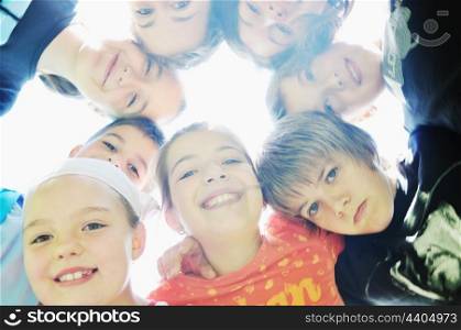 happy child group smilling together and hold heads very close