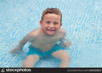 Happy child in summer bathing in the pool