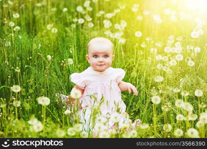 happy child in the field of dandelions