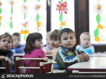 happy child kids group have fun and play at kindergarden indoor preschool education concept with teacher