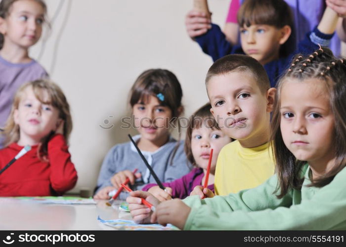 happy child kids group have fun and play at kindergarden indoor preschool education concept with teacher