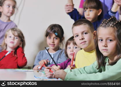 happy child kids group have fun and play at kindergarden indoor preschool education concept with teacher