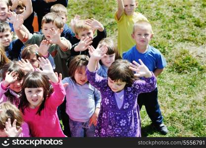 happy child kids group have fun and play at kindergarden preschool education concept with teacher