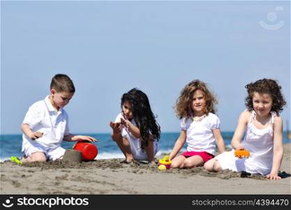 happy child kids have fun and play games on beach