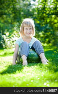 Happy child playing outdoors in spring park