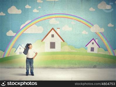 Happy childhood. Boy of school age with skateboard against drawn colorful background